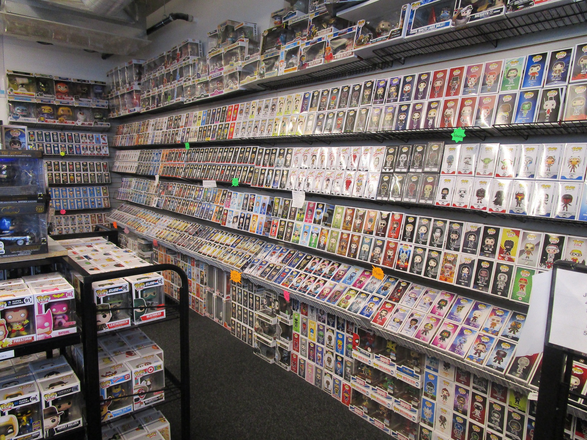 Wall of Funko Pops and trading cards